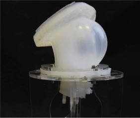 Soft pneumatic actuator bending under applied pressure.