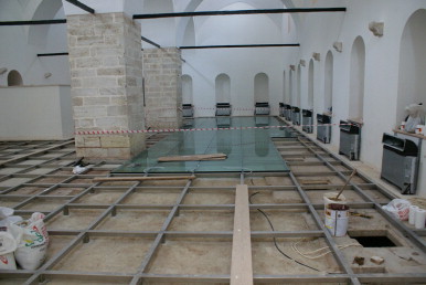 Covering the original floor with glass panels.