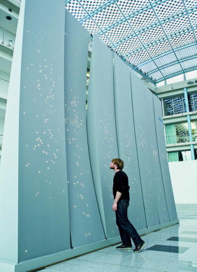 The skin of each InteractiveWall covered by a unique, irregular distribution of ...