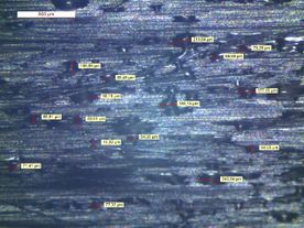 Figura 11. Imágenes de Fibra Seca con binder de PA6. a) Bobina fibra seca con binder PA6 B3S (<100micras). b) Igual que a).