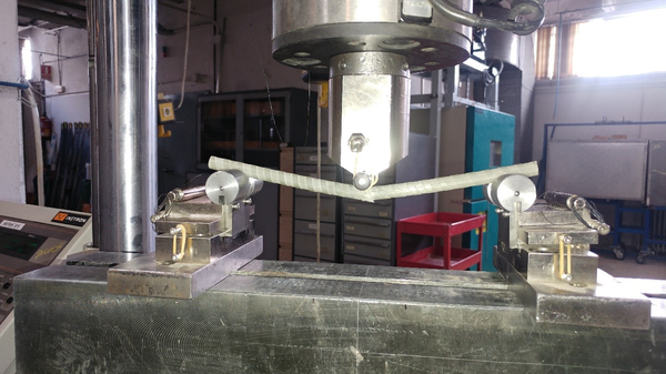Three-point bending tests. Failed specimen of PFR rebar