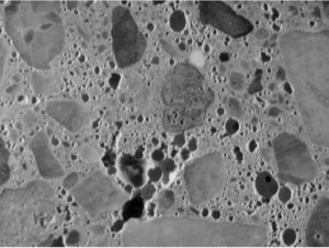 Detail of paste, agregate and voids in concrete